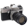 Vintage Praktica camera with black lens on a white background