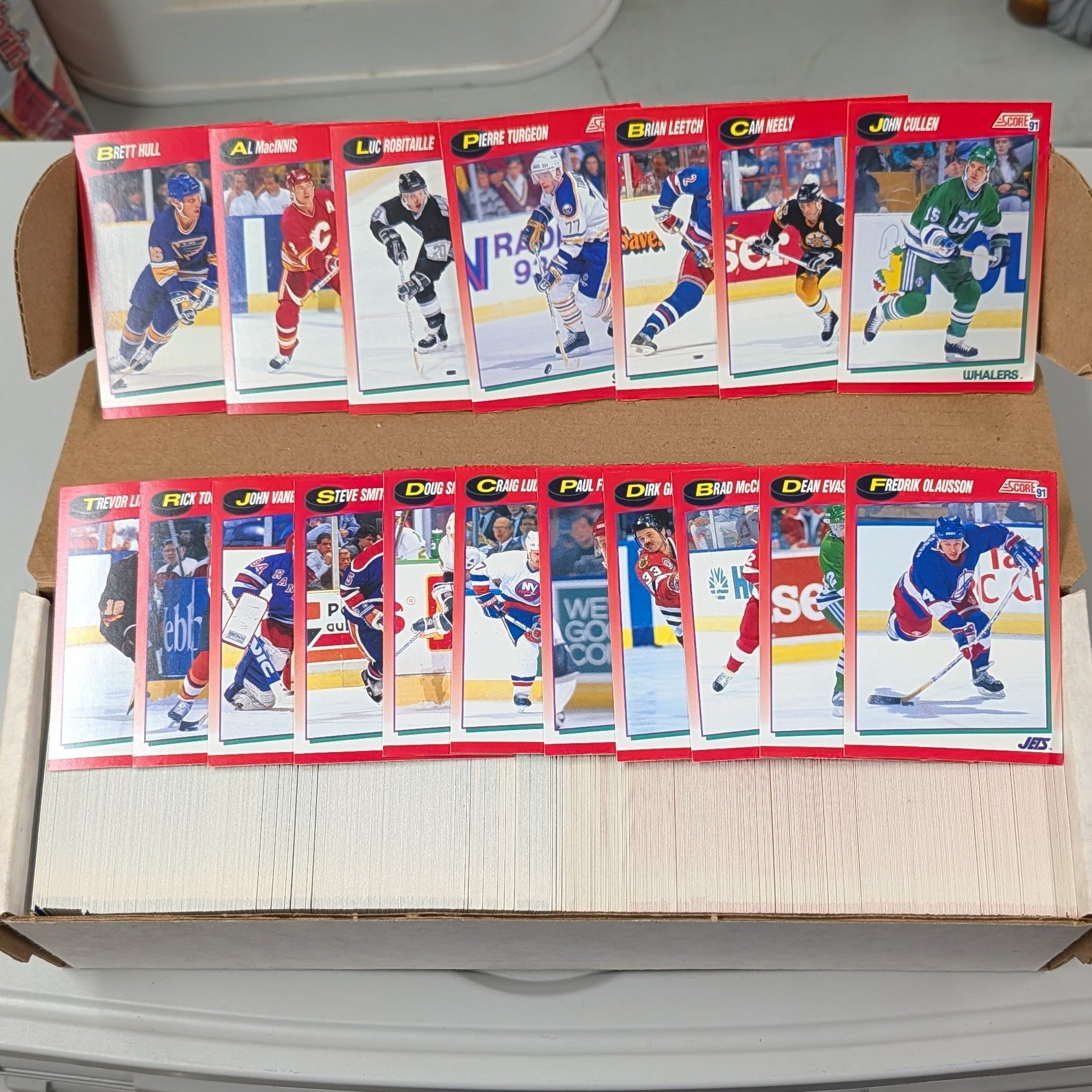 Collection of hockey trading cards in a box