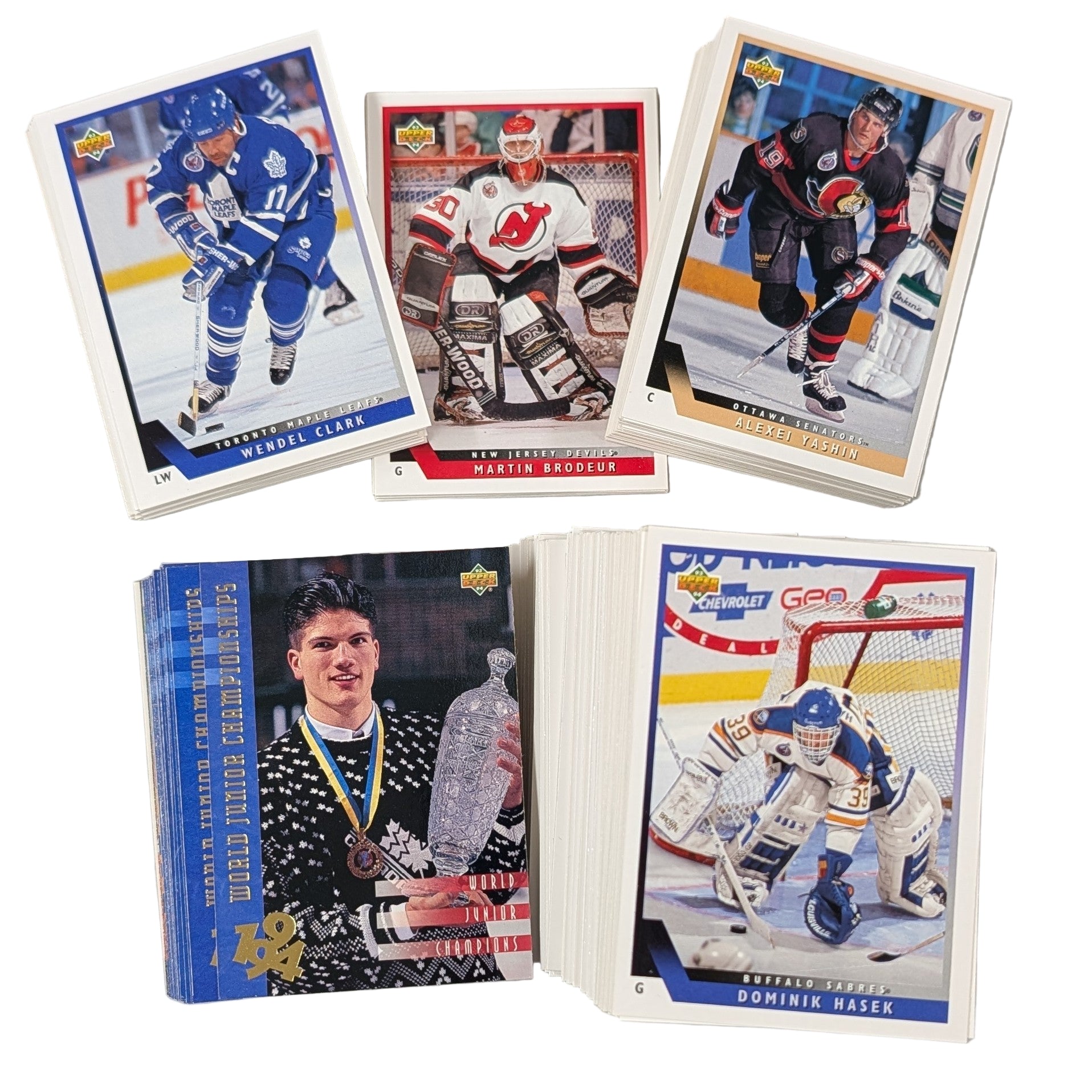 Collection of hockey trading cards on a white surface