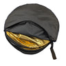 A round black soft-sided accessory with a gold reflective interior lining, shown open on a white background.