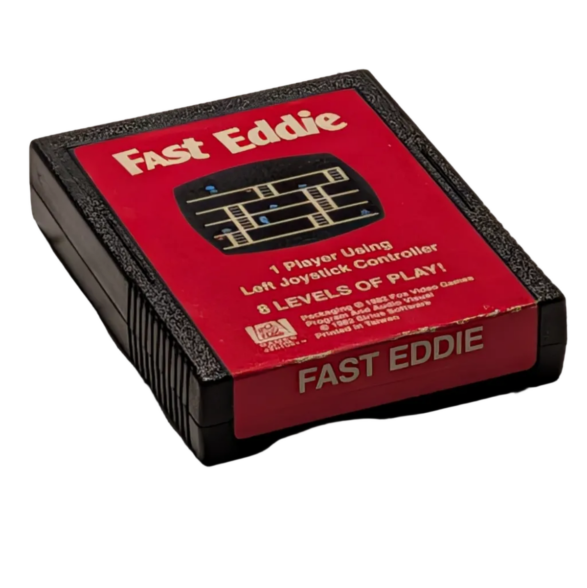 A vintage-style video game cartridge labeled 'Fast Eddie' on a white surface. The cartridge has a red front label, black side edges, and small white text detailing gameplay features.