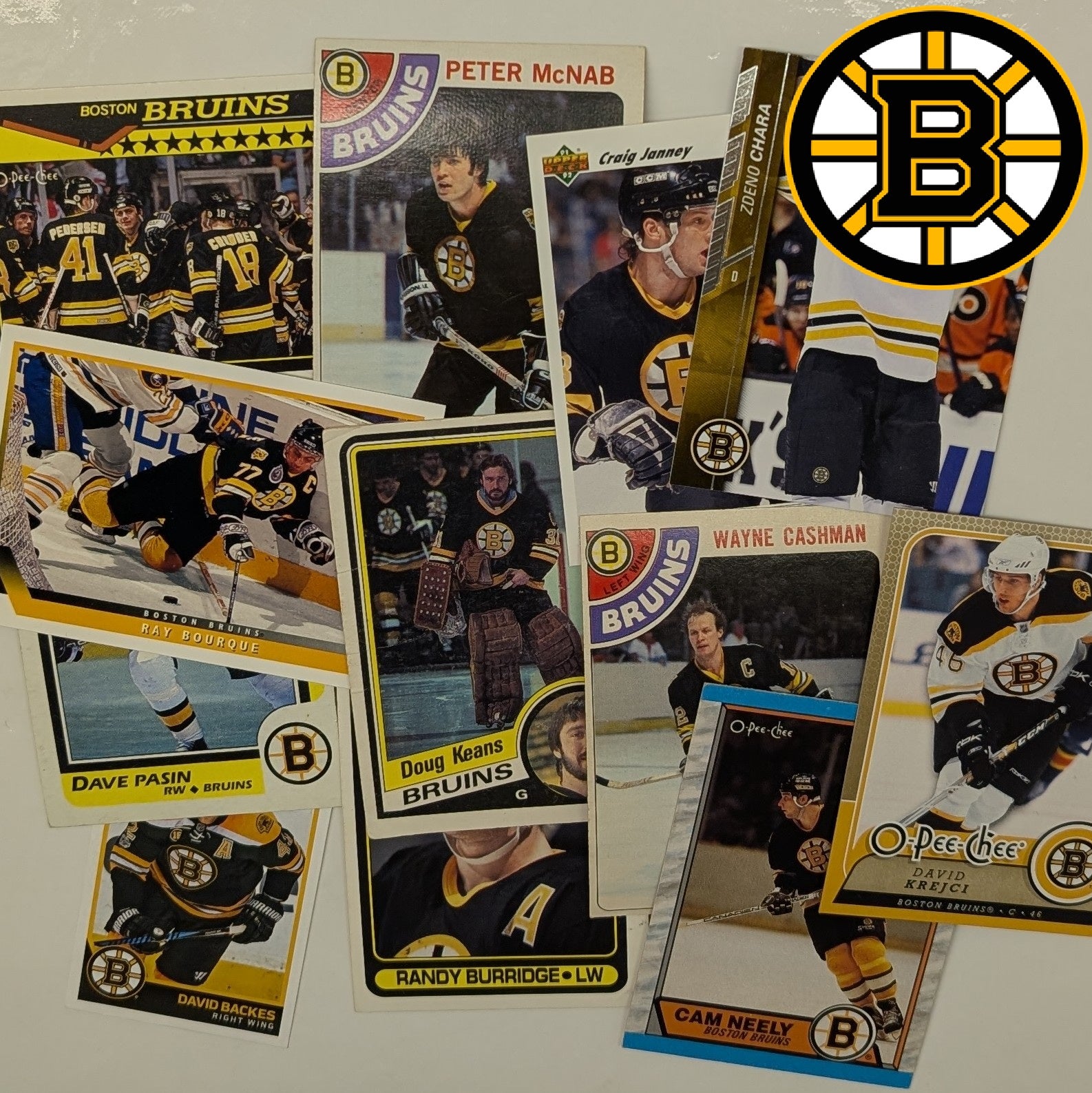 Collection of Boston Bruins hockey trading cards on a white background