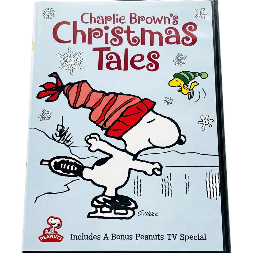 Charlie Brown's Christmas Tales DVD cover featuring Snoopy ice skating in a snowy scene with Peanuts characters, shown on a plain white background.