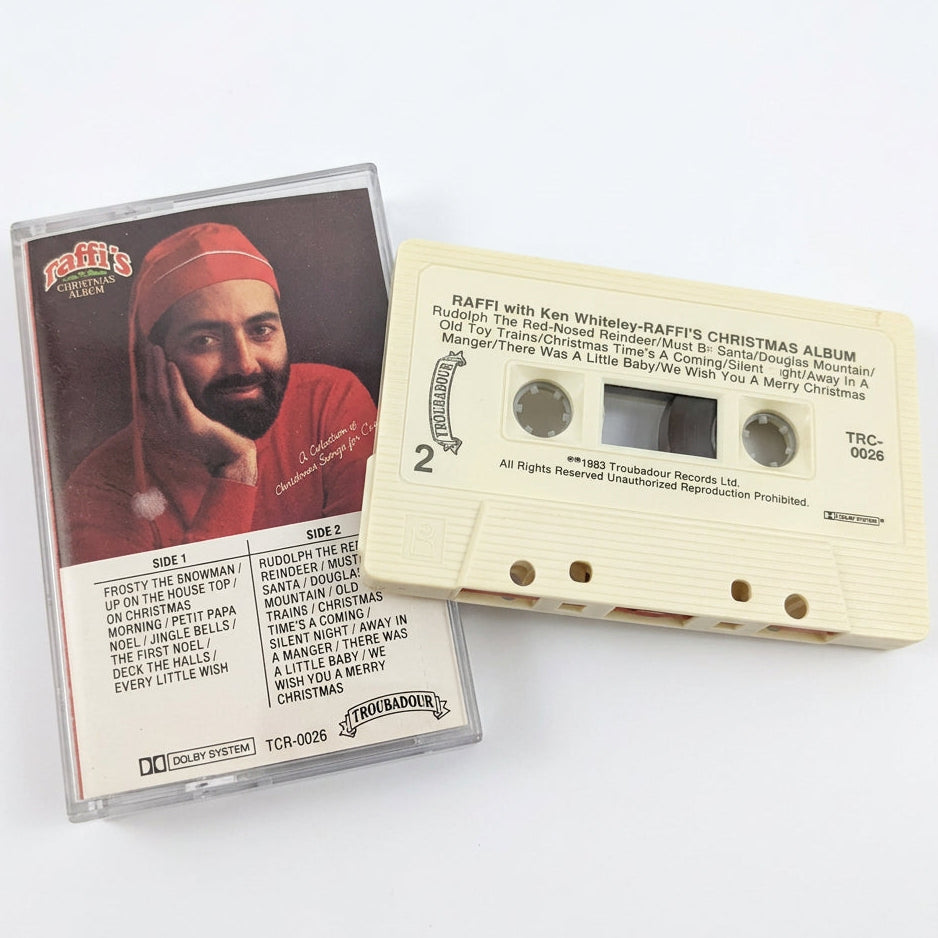 A cassette tape and its printed sleeve on a white background.