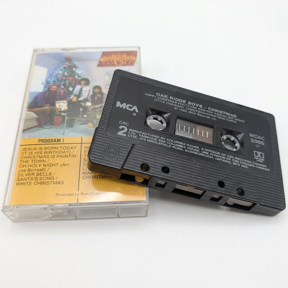 A vintage MCA 16-track cassette tape and its clear plastic jewel case, both featuring the 'Ram One Two Boys - Christmas' album cover, displayed on a white surface.