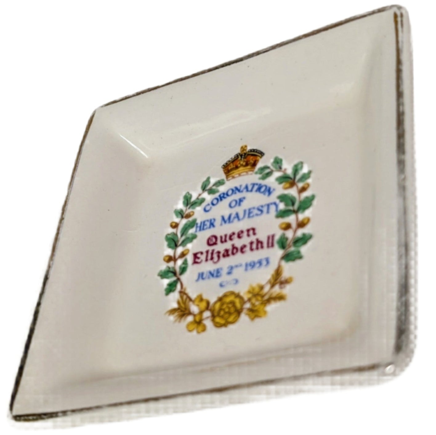 Small decorative dish with a crest and text on a white background