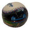Baseball with a colorful design on a white surface
