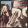 Album cover with two people covering their faces and the text 'Harlequin' and 'Victim of a Song'.