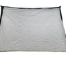 A large white fabric backdrop or sheet with black trim