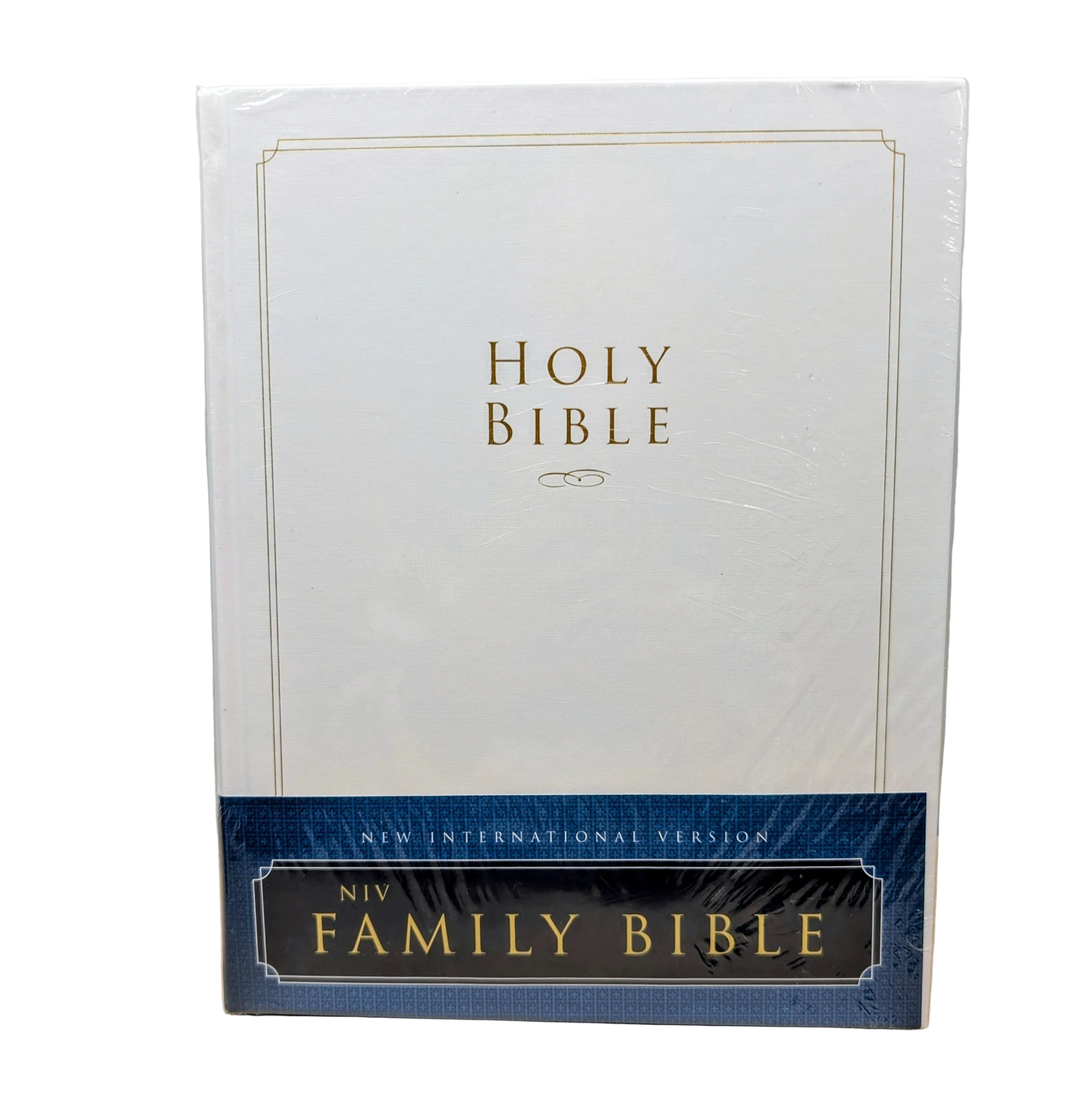 NIV Family Bible with white cover and blue banner on a beige surface