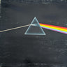 Pink Floyd 'The Dark Side of the Moon' vinyl record album cover, showing the classic prism graphic on a textured black background.