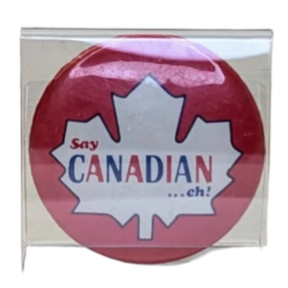 Red button with a white maple leaf 
