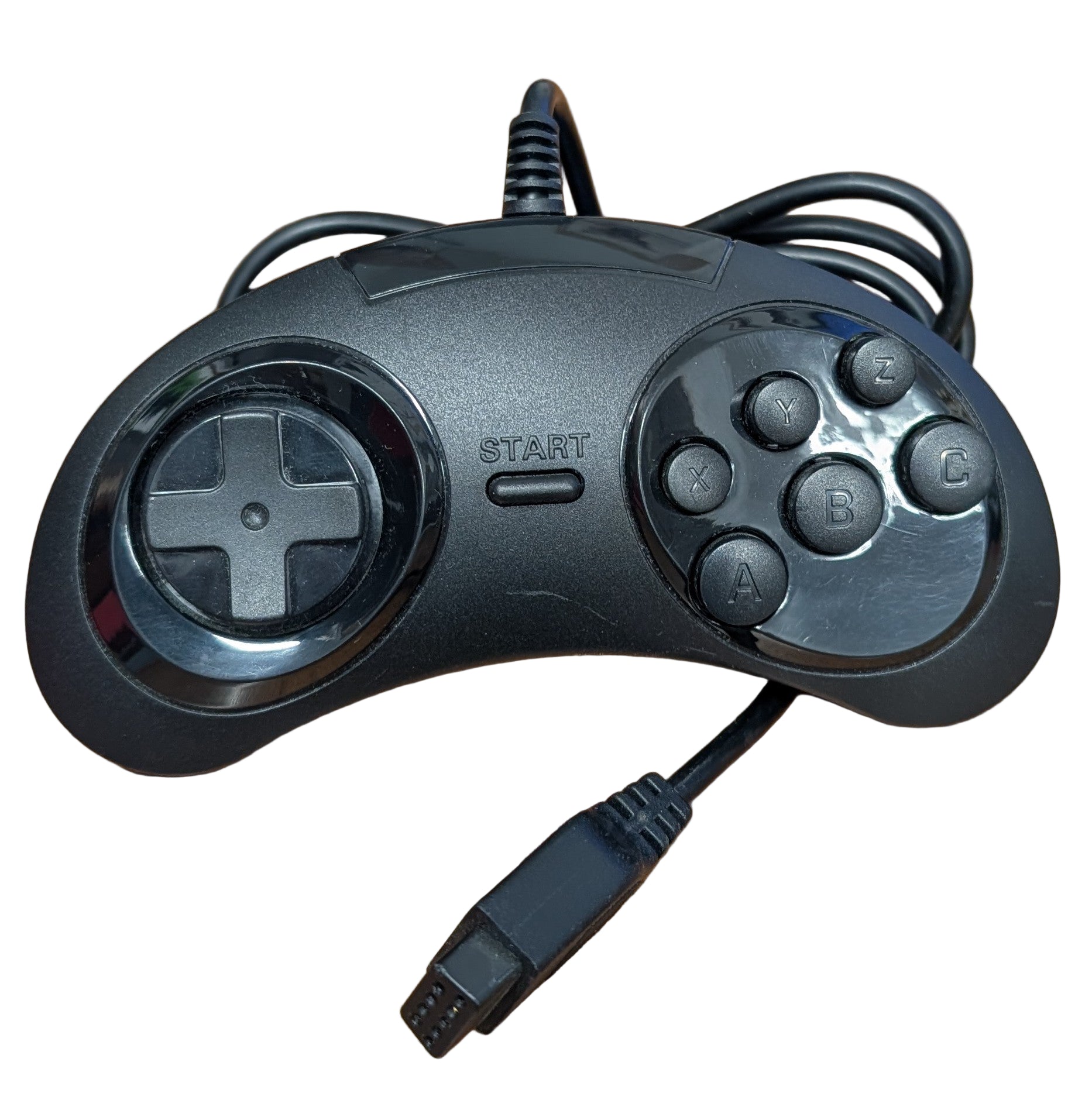 Black gaming controller on a white surface