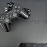 PlayStation 3 console with one controller and power cord