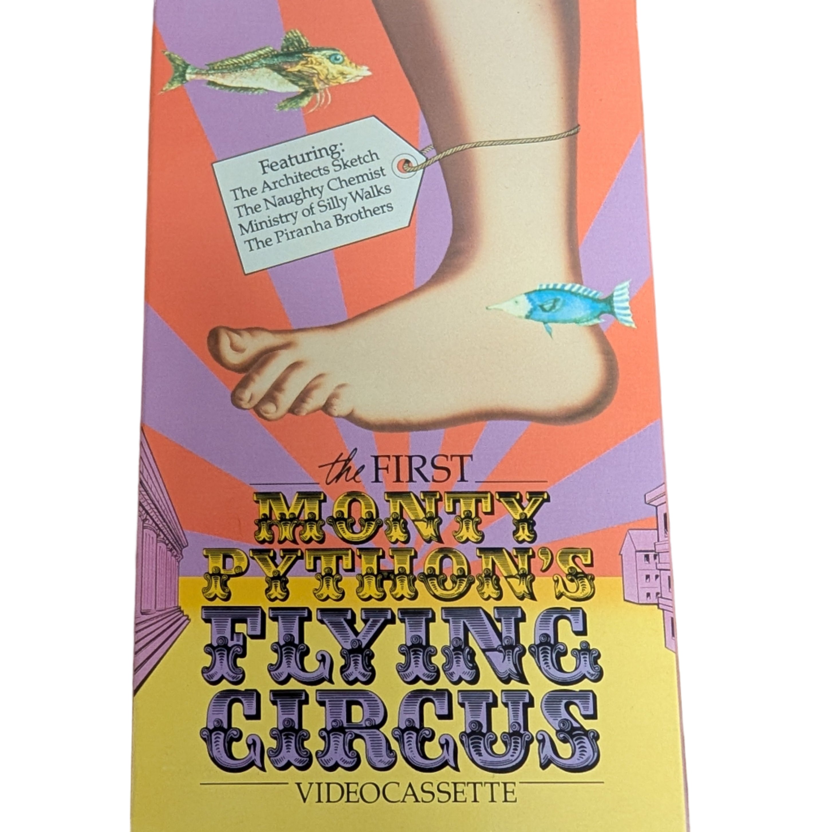 Videocassette cover of 'The First Monty Python's Flying Circus' on a wooden surface