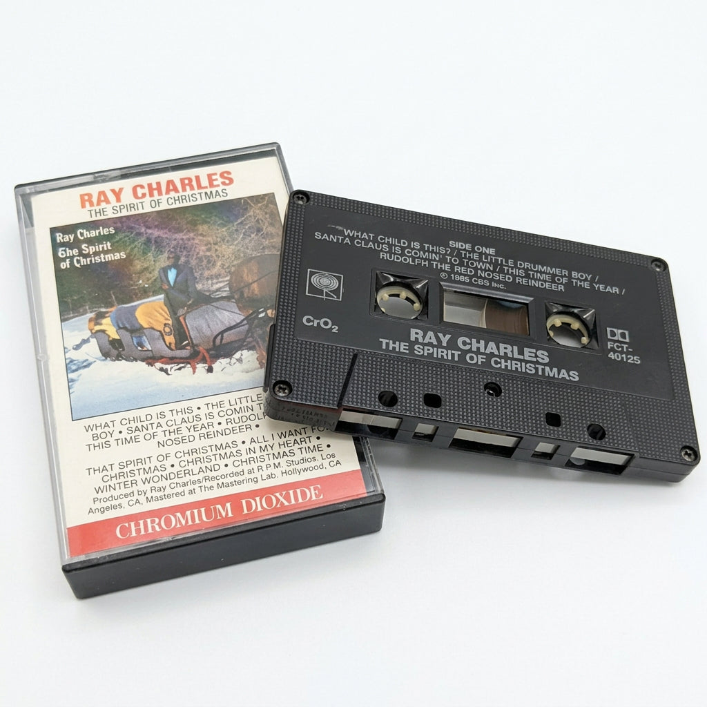 A vintage Ray Charles cassette tape and its paper sleeve are displayed on a white background.