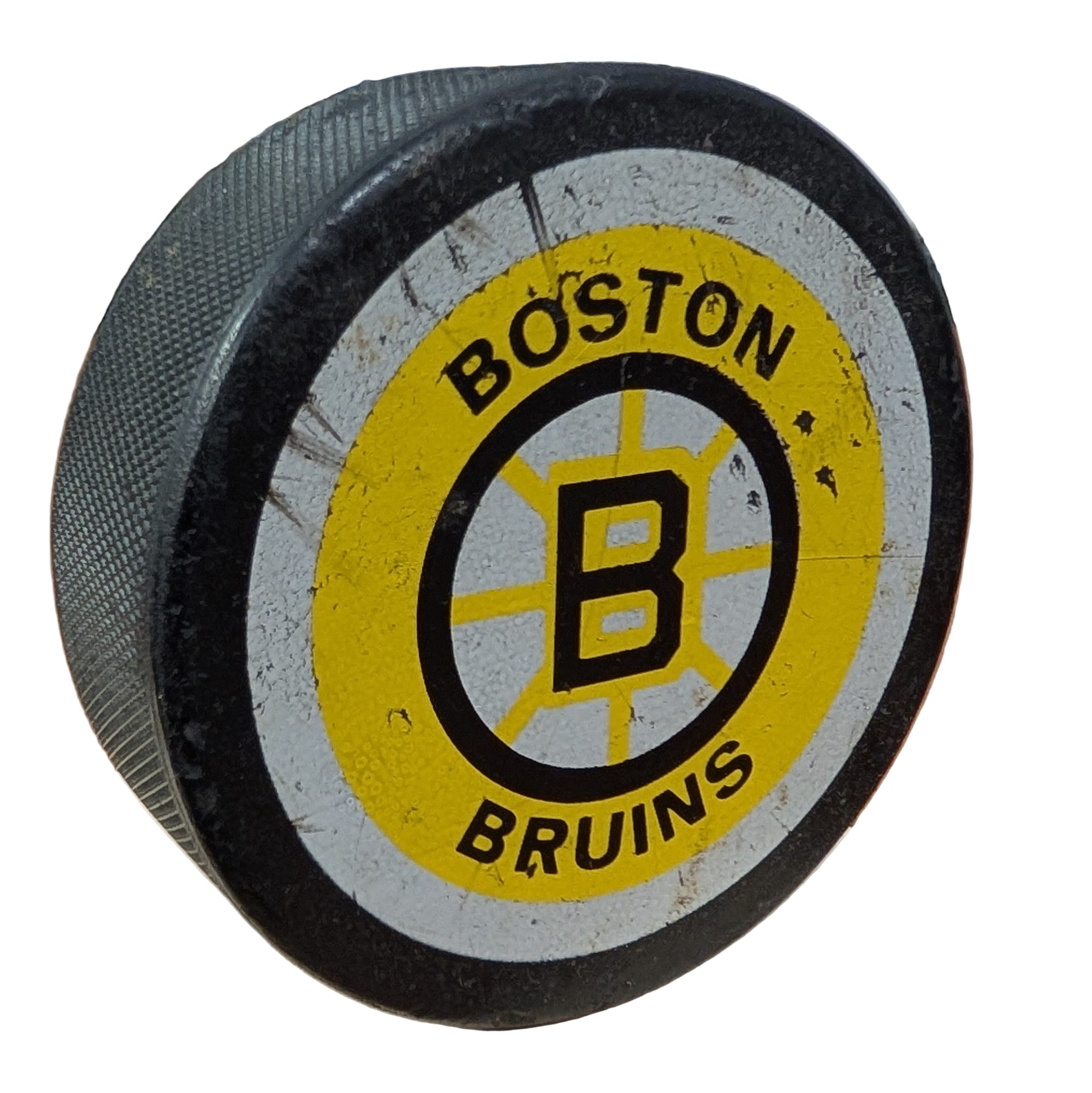 Vintage Boston Bruins hockey puck on a white background 
