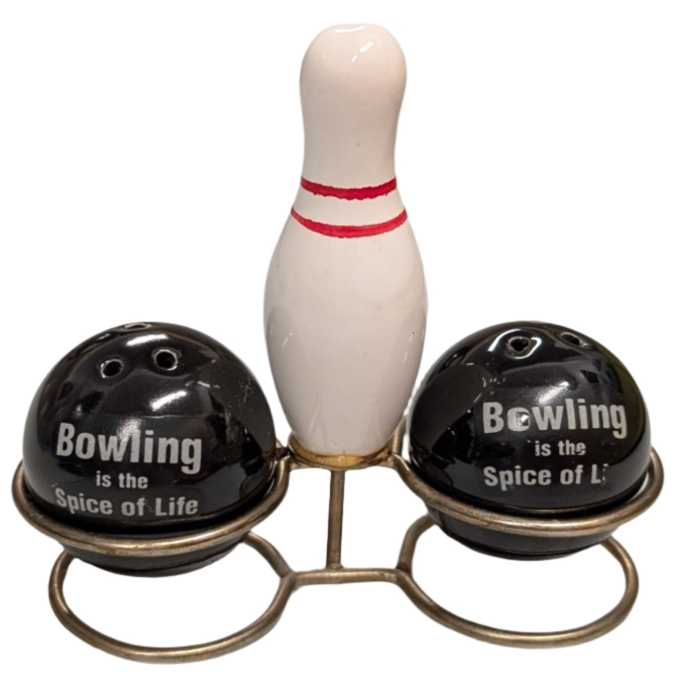 Bowling-themed salt & pepper set with balls and a pin on a white surface