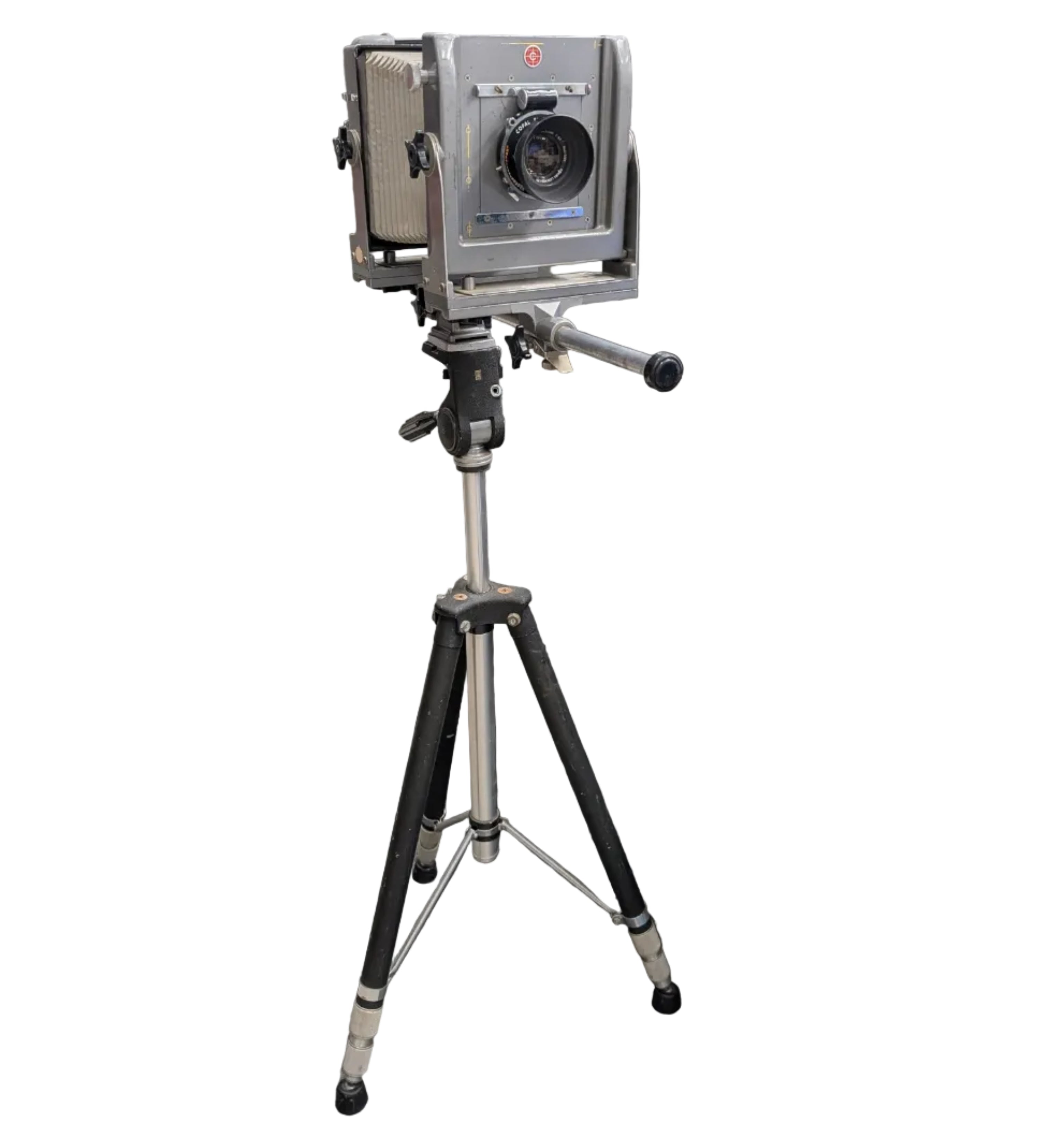 A vintage medium format camera, mounted on a tripod