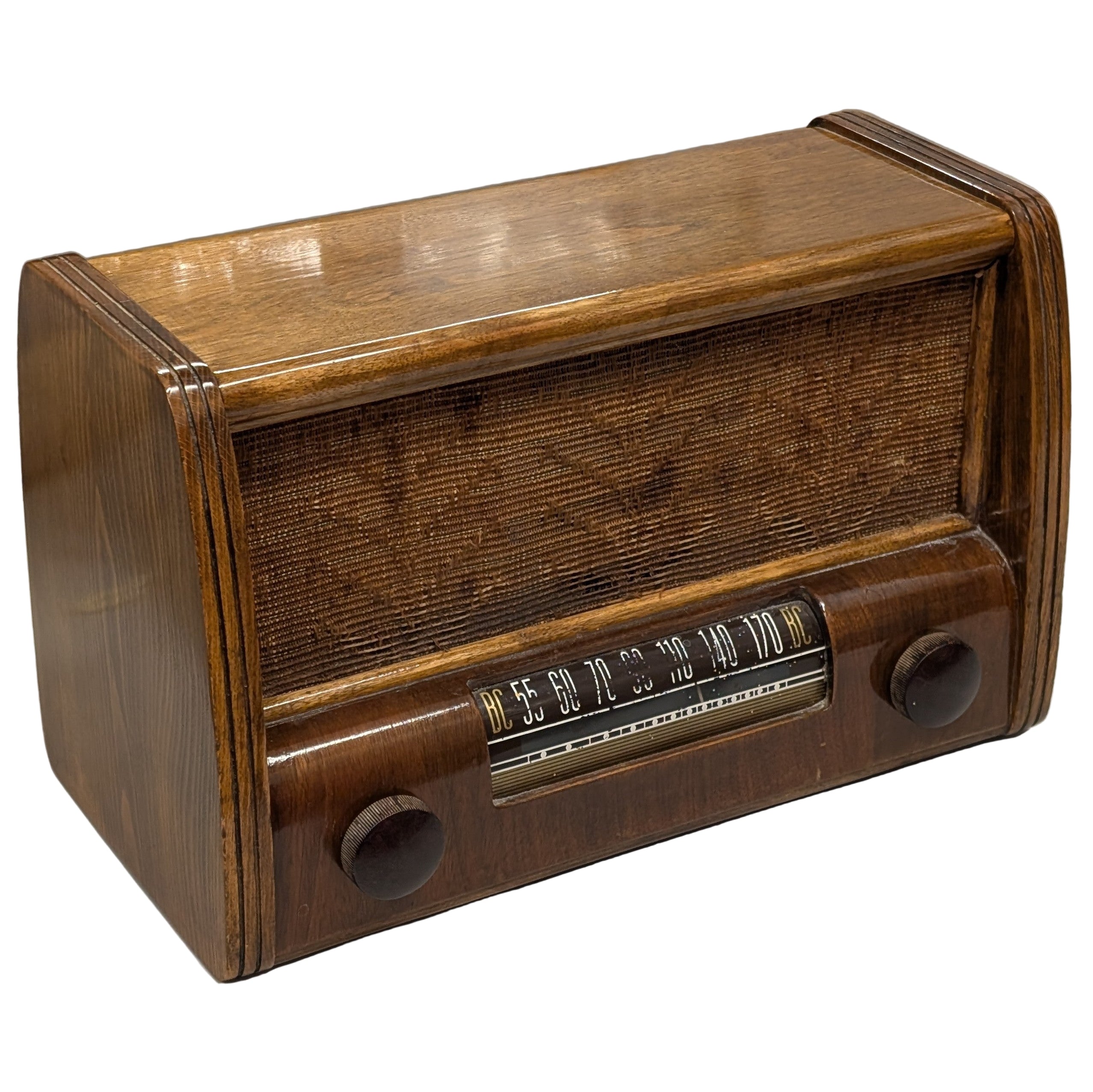 Vintage wooden radio on a white surface