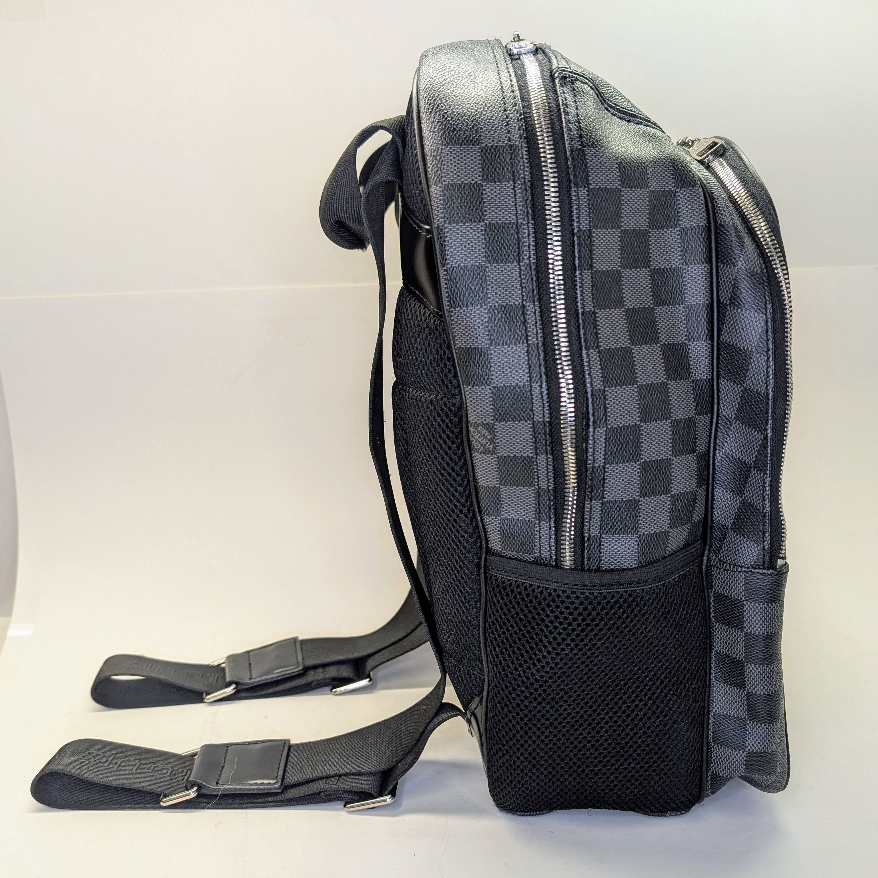 Black and gray checkered backpack on a white background